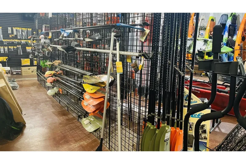 Slide: The Image of Fishing store with paddles and gear, Jackson Blue Sky 360 Angler 2022. - 4