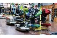 Slide: The Image of Jackson Take Two - Rad 2023 kayaks displayed in a showroom. - 5