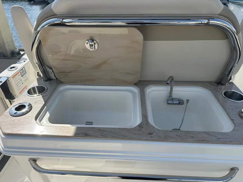 Slide: The Image of The 2027 Boston Whaler 280 Dauntless features a sleek sink with dual basins and a faucet. - 18