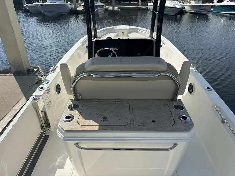 Slide: The Image of The image shows the cockpit of a 2027 Boston Whaler 280 Dauntless, docked at a marina. - 17
