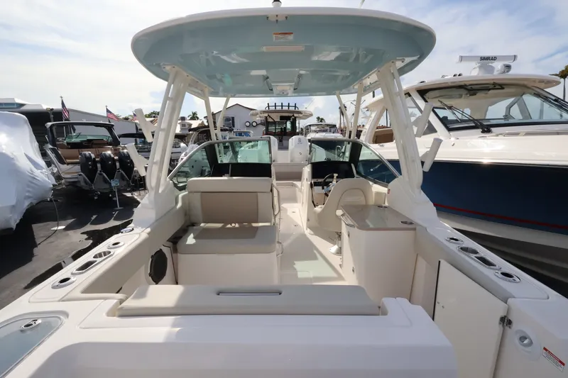 Slide: The Image of Boston Whaler 240 Vantage 2027: Spacious cockpit with seating, helm station, and sunshade. - 9