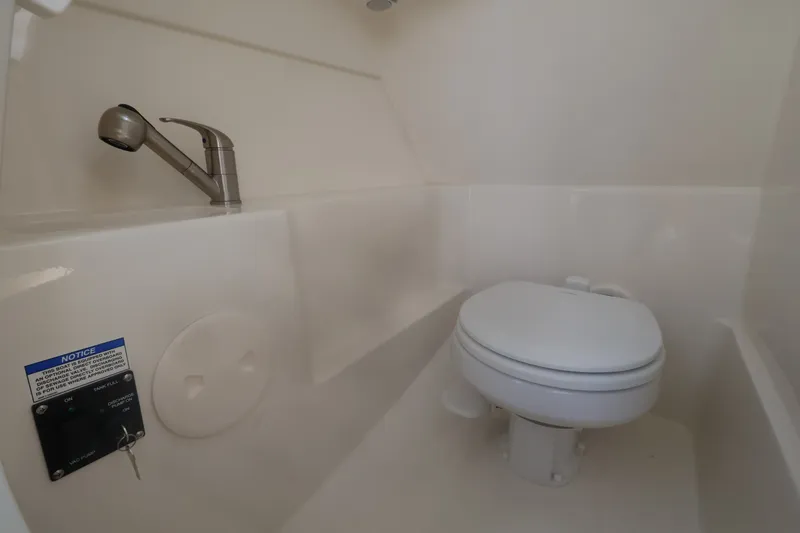 Slide: The Image of Interior of a boat cabin with a toilet and sink. - 28
