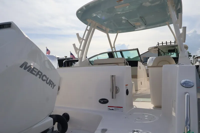 Slide: The Image of 2027 Boston Whaler 240 Vantage with spacious cockpit and Mercury engine. - 8