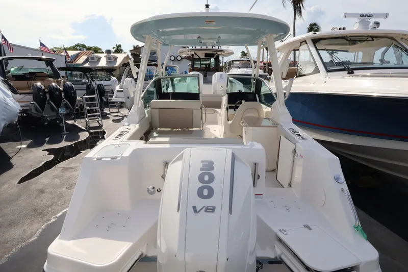 Slide: The Image of The image shows a 2027 Boston Whaler 240 Vantage boat with a 300 HP V8 engine. - 6