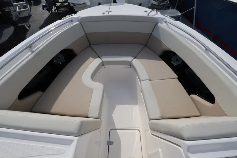Slide: The Image of The 2027 Boston Whaler 240 Vantage features a spacious, cushioned seating area in the bow. - 32