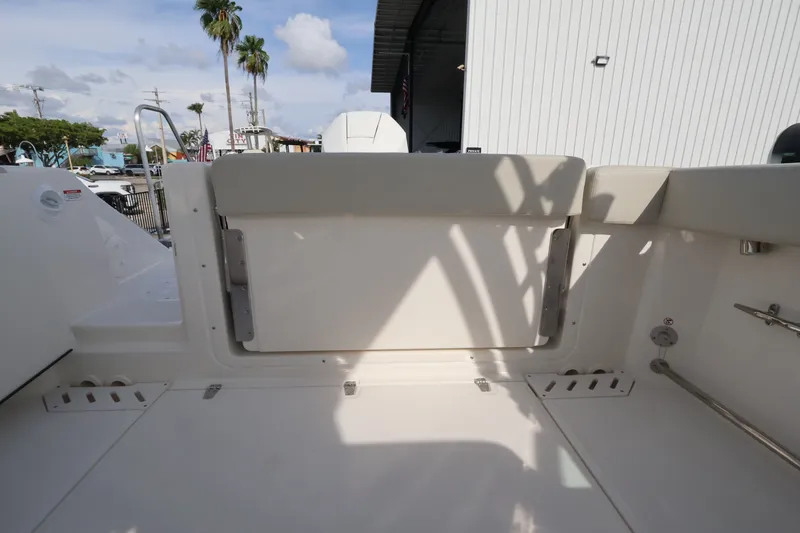 Slide: The Image of The image shows the cockpit of a 2027 Boston Whaler 240 Vantage with white seating. - 12