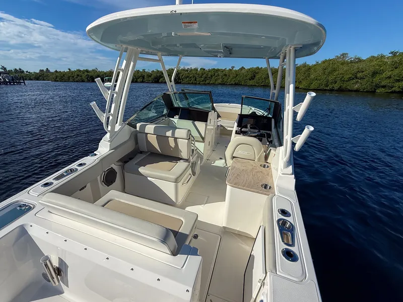 Slide: The Image of The image shows a 2027 Boston Whaler 240 Vantage boat on calm waters. - 7
