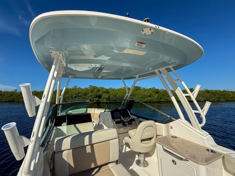 Slide: The Image of The image shows the cockpit of a 2027 Boston Whaler 240 Vantage with a modern helm and comfortable seating. - 9