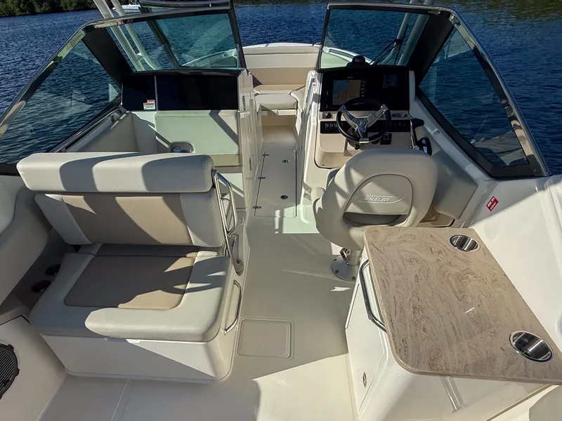 Slide: The Image of The image shows the cockpit of a 2027 Boston Whaler 240 Vantage with comfortable seating and a helm station. - 8