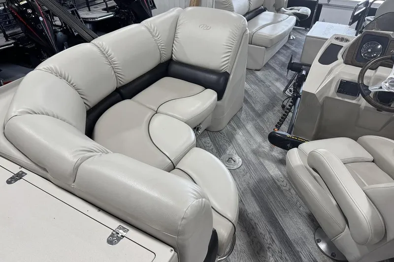 Slide: The Image of Luxurious interior of 2016 Manitou 24 Aurora LE Angler pontoon boat with plush seating. - 12