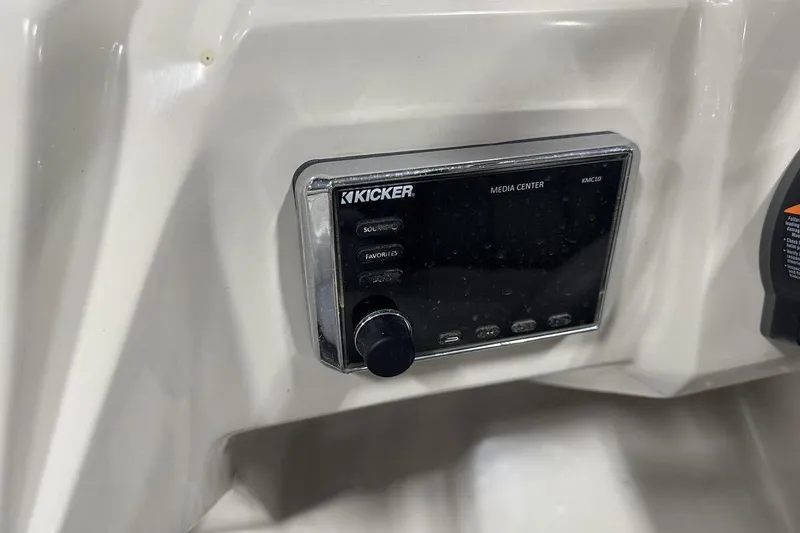 Slide: The Image of Kicker media center in 2016 Manitou 24 Aurora LE Angler boat dashboard. - 14