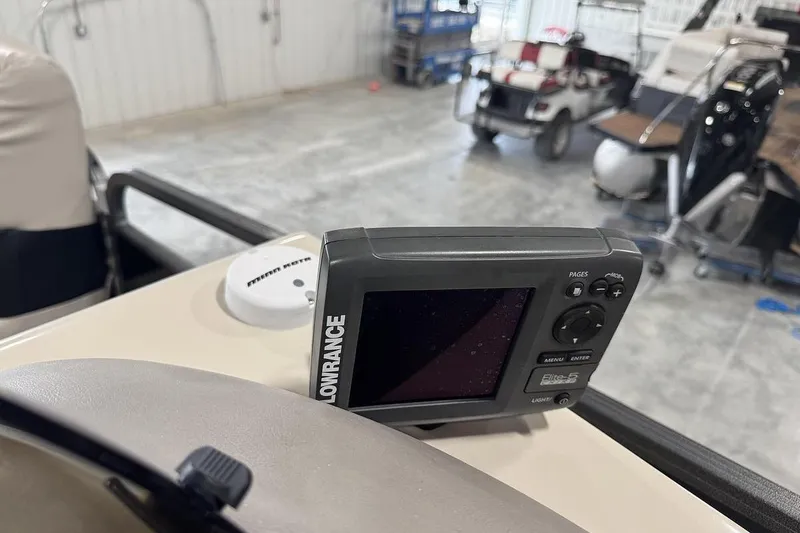Slide: The Image of Lowrance Elite-5 fish finder on 2016 Manitou 24 Aurora LE Angler boat dashboard. - 15