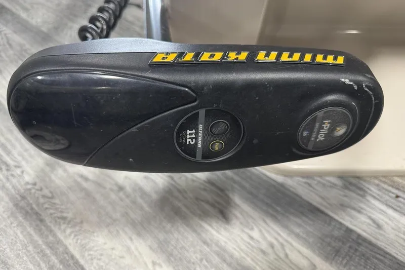Slide: The Image of Close-up of a Minn Kota trolling motor control on a 2016 Manitou 24 Aurora LE Angler. - 16