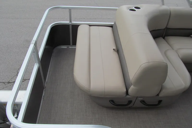 Slide: The Image of 2023 Sun Tracker Party Barge 18 DLX with beige seating and cup holders. - 11
