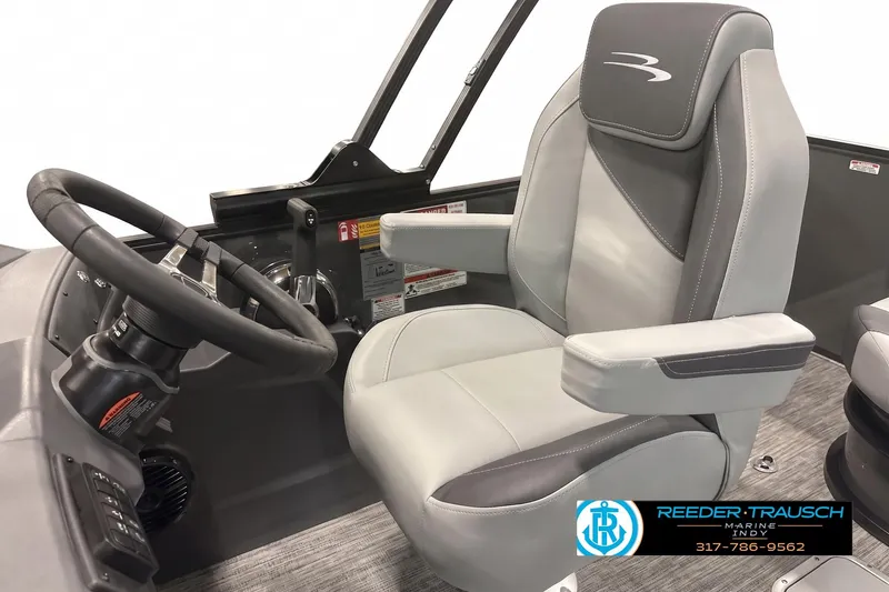 Slide: The Image of Captain's seat and steering wheel of 2026 Bennington 22 SSB boat, featuring modern design. - 3