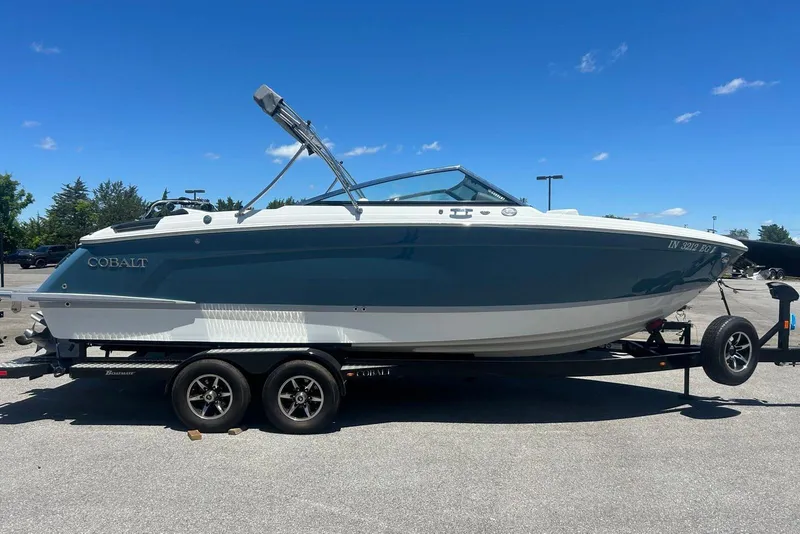The Image of 2021 Cobalt R6 boat on trailer under clear blue sky. - 0