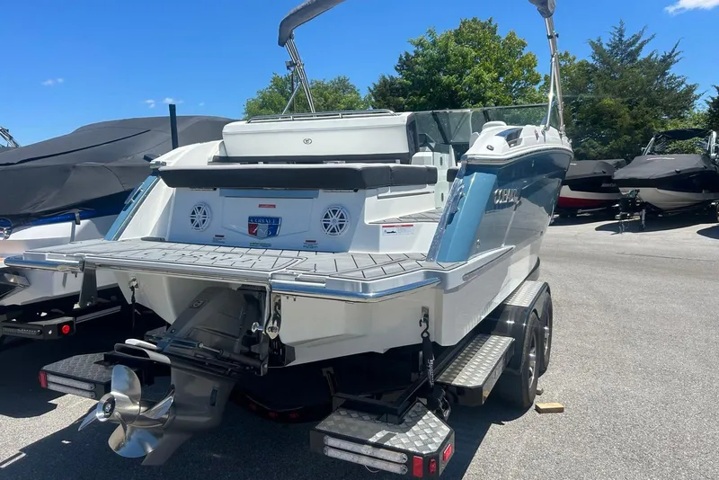 Slide: The Image of 2021 Cobalt R6 boat on trailer, showcasing sleek design and powerful engine. - 2