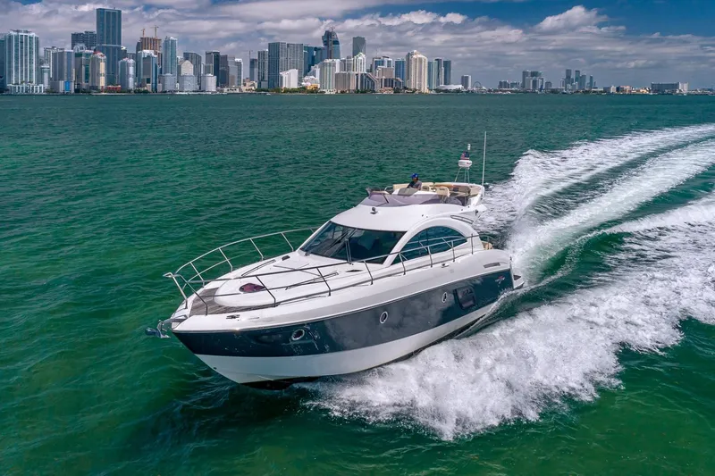 The Image of Beneteau Gran Turismo 49 Fly yacht cruising near city skyline, 2011 model. - 0