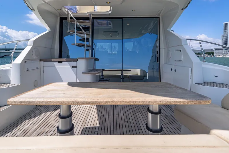 Slide: The Image of Luxury yacht Beneteau Gran Turismo 49 Fly, 2011, featuring elegant outdoor seating area. - 13