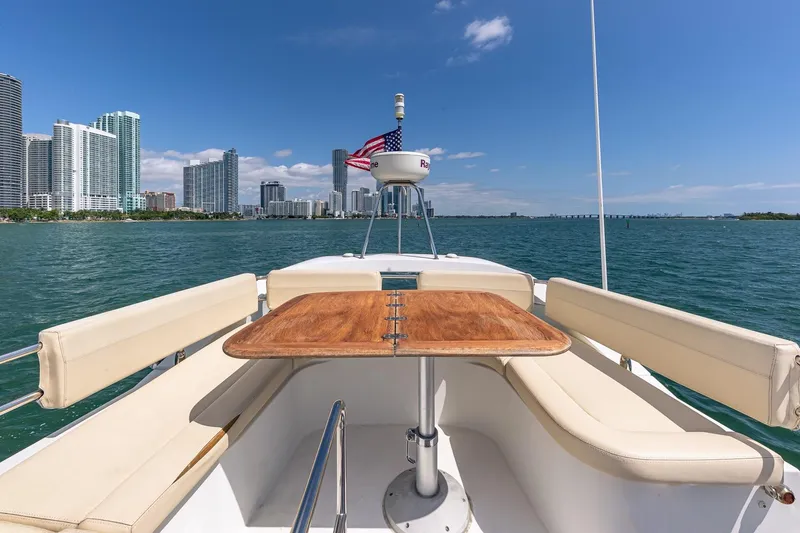 Slide: The Image of Beneteau Gran Turismo 49 Fly yacht with city skyline and ocean view, 2011 model. - 17