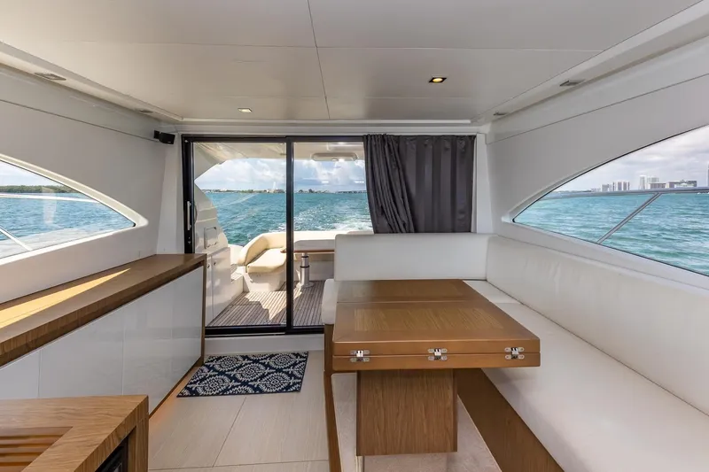 Slide: The Image of Interior of 2011 Beneteau Gran Turismo 49 Fly yacht, featuring elegant seating and ocean view. - 19