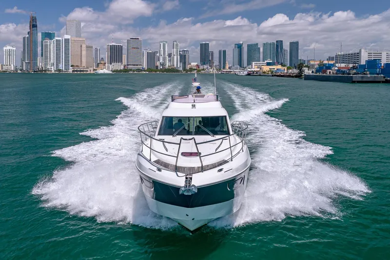 Slide: The Image of Beneteau Gran Turismo 49 Fly yacht cruising near city skyline, 2011 model. - 2
