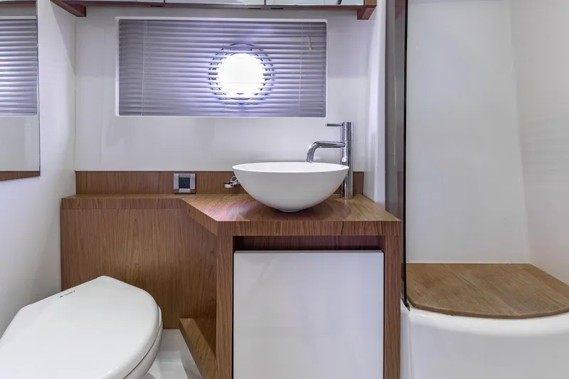 Slide: The Image of Modern bathroom interior on 2011 Beneteau Gran Turismo 49 Fly yacht, featuring sleek wood accents. - 37