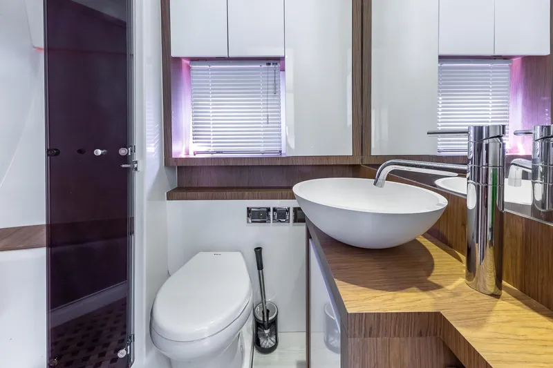 Slide: The Image of Modern bathroom on 2011 Beneteau Gran Turismo 49 Fly yacht with sleek fixtures and wood accents. - 38