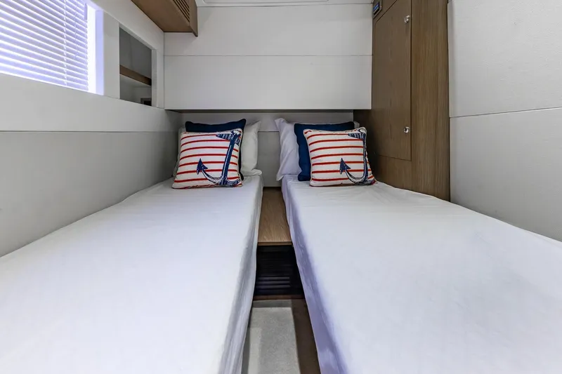 Slide: The Image of Twin cabin with nautical-themed pillows on Beneteau Gran Turismo 49 Fly, 2011 model. - 39