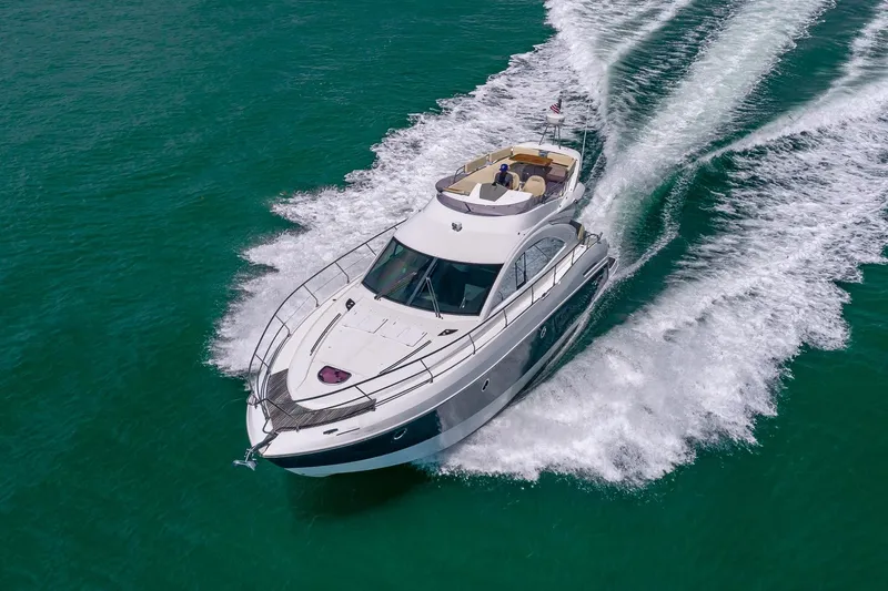 Slide: The Image of Beneteau Gran Turismo 49 Fly 2011 cruising on turquoise waters, aerial view. - 5