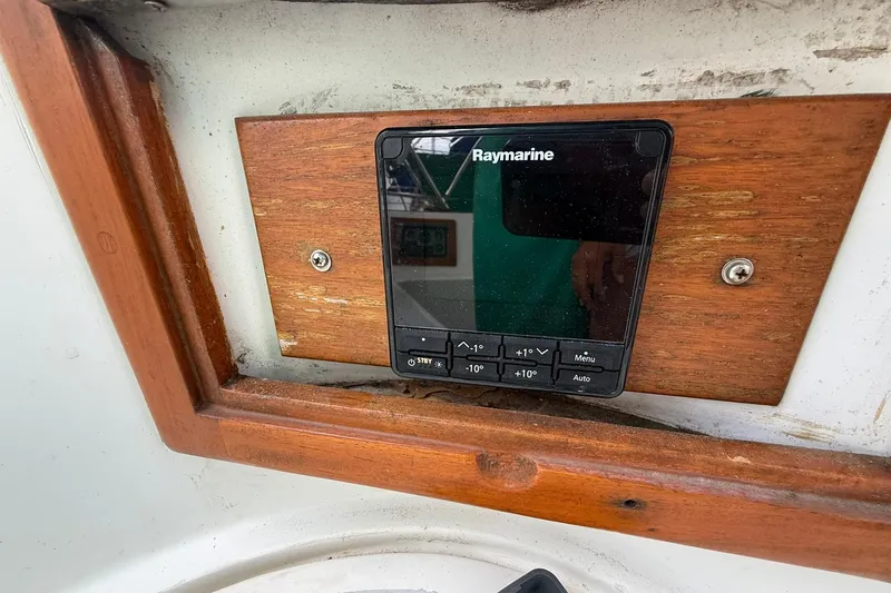 Slide: The Image of Raymarine control panel on 1989 Cabo Rico 34 sailboat, mounted on wooden frame. - 18