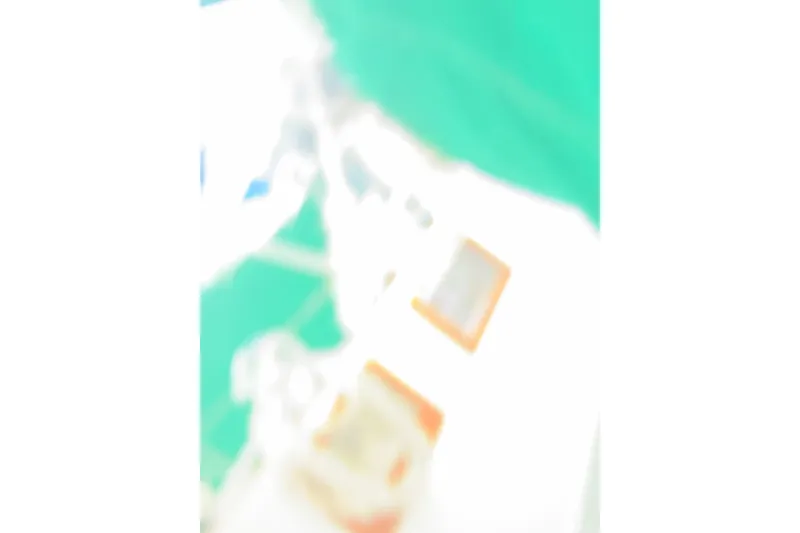 Slide: The Image of Blurry image of a 1989 Cabo Rico 34 sailboat with green and white colors. - 20