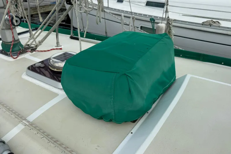 Slide: The Image of Green-covered equipment on 1989 Cabo Rico 34 sailboat deck. - 25
