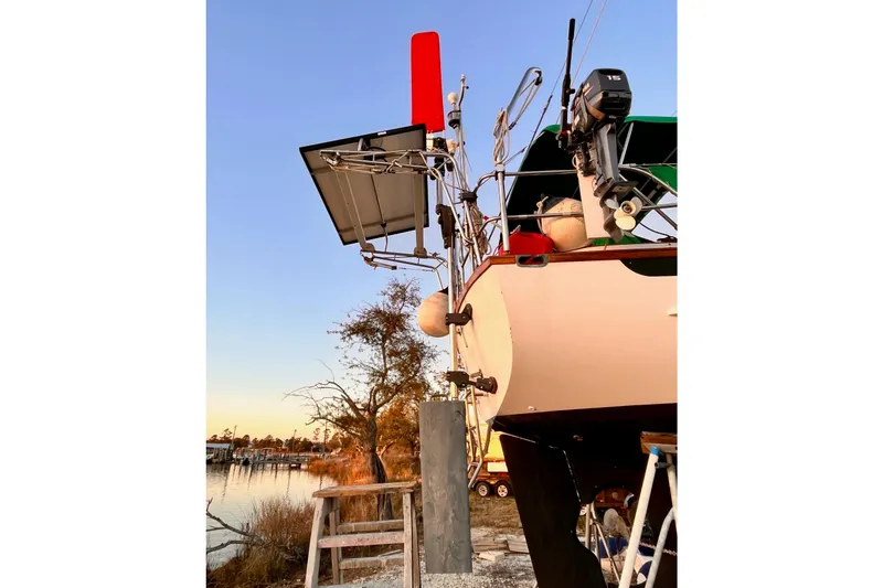 Slide: The Image of Cabo Rico 34 sailboat from 1989 with solar panel and motor at sunset. - 26