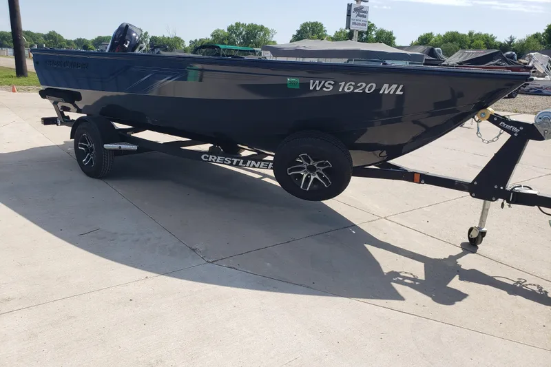 Slide: The Image of 2024 Crestliner 1650 Pro Tiller boat on trailer, parked outdoors. - 3