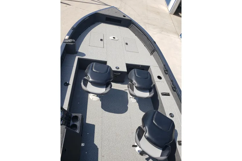 Slide: The Image of 2024 Crestliner 1650 Pro Tiller boat interior with three seats and spacious deck. - 4