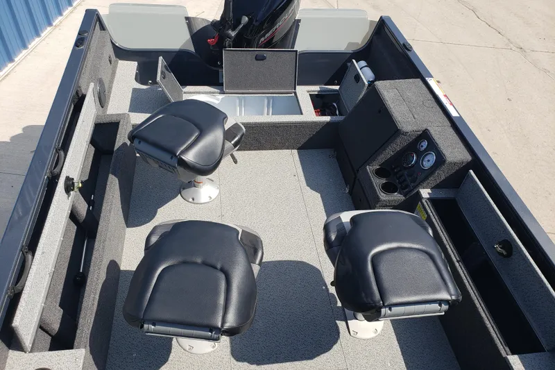 Slide: The Image of 2024 Crestliner 1650 Pro Tiller boat interior with seating and control panel. - 7