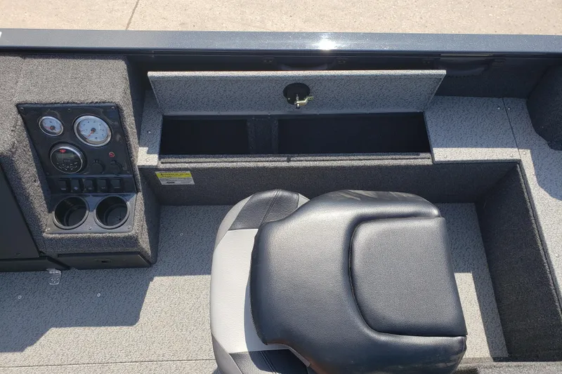 Slide: The Image of 2024 Crestliner 1650 Pro Tiller boat interior with control panel and seating. - 8