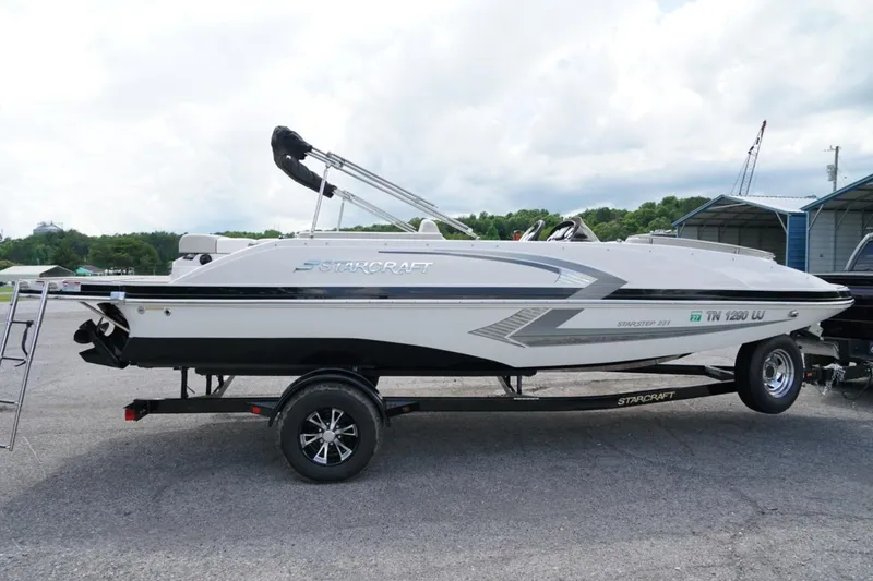 The Image of 2019 Starcraft Star Step 221 E I/O boat on trailer, parked outdoors. - 0