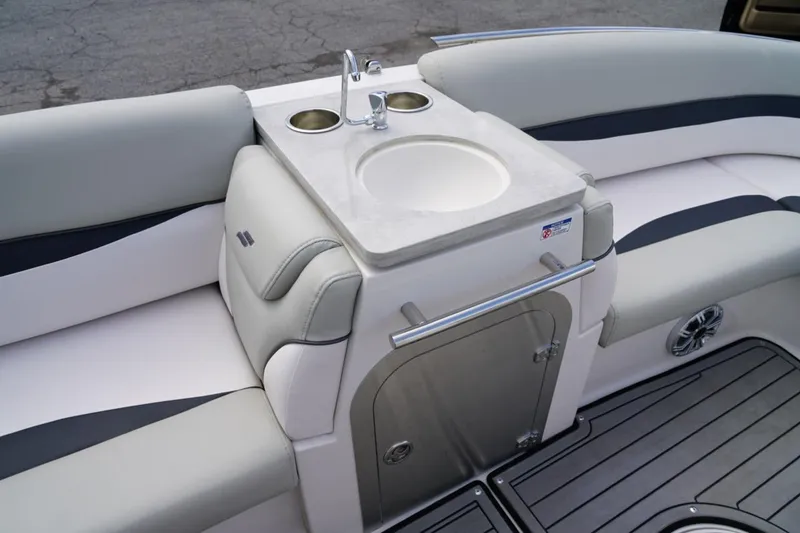 Slide: The Image of 2019 Starcraft Star Step 221 E I/O boat interior with sink and seating area. - 10