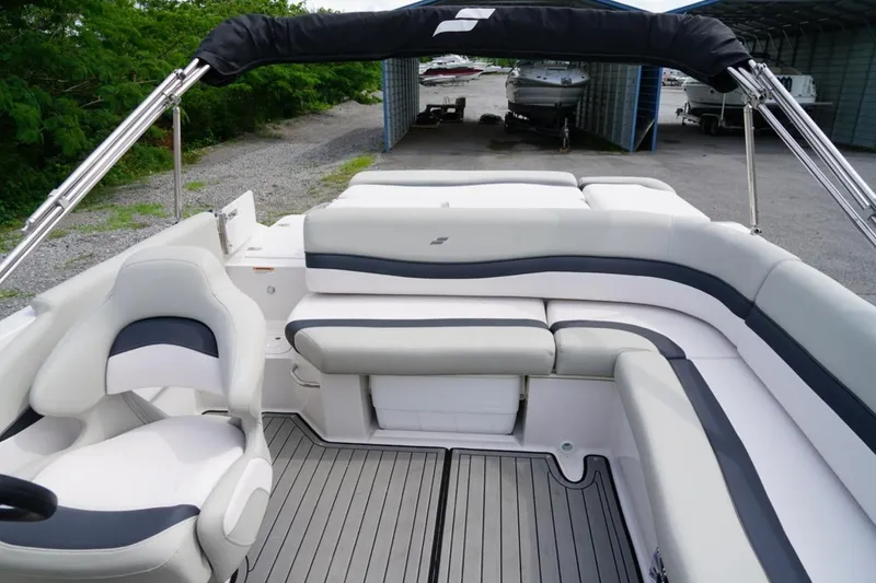 Slide: The Image of 2019 Starcraft Star Step 221 E I/O boat interior with seating and canopy. - 14