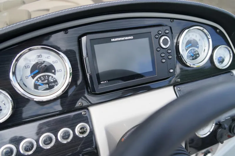 Slide: The Image of Dashboard of 2019 Starcraft Star Step 221 E I/O with gauges and Humminbird Helix 5. - 17