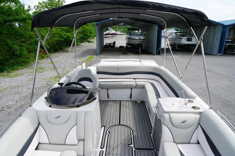 Slide: The Image of 2019 Starcraft Star Step 221 E I/O boat with spacious seating and canopy in storage area. - 22