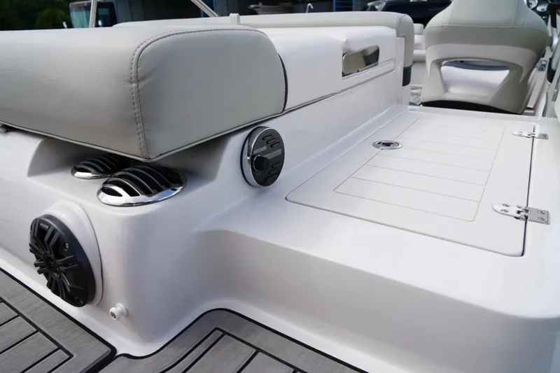 Slide: The Image of 2019 Starcraft Star Step 221 E I/O boat interior with speakers and seating. - 8