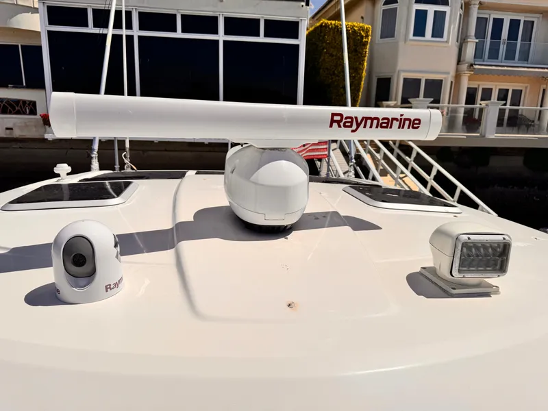 Slide: The Image of 2014 Pursuit OS 385 Offshore boat with Raymarine radar and camera on deck. - 21