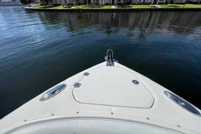 Slide: The Image of Bow view of 2014 Chaparral 307 SSX boat on calm water. - 6