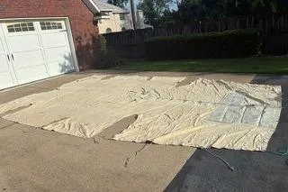 Slide: The Image of Large sail laid out on driveway, Corsair F24 MKI, 1994 model, near brick garage. - 9