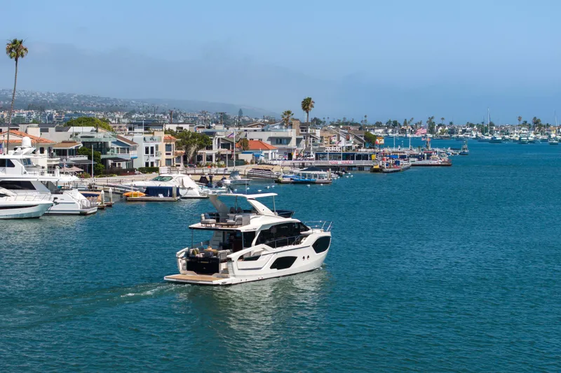 Slide: The Image of Luxury yacht Absolute 52 Fly 2026 cruising in scenic coastal marina. - 60