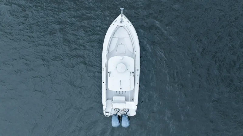 Slide: The Image of Aerial view of 2013 Robalo R260 Center Console boat on water. - 13