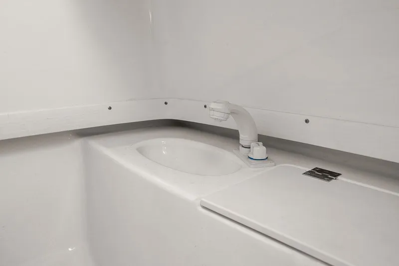 Slide: The Image of Interior of 2013 Robalo R260 Center Console with sink. - 18